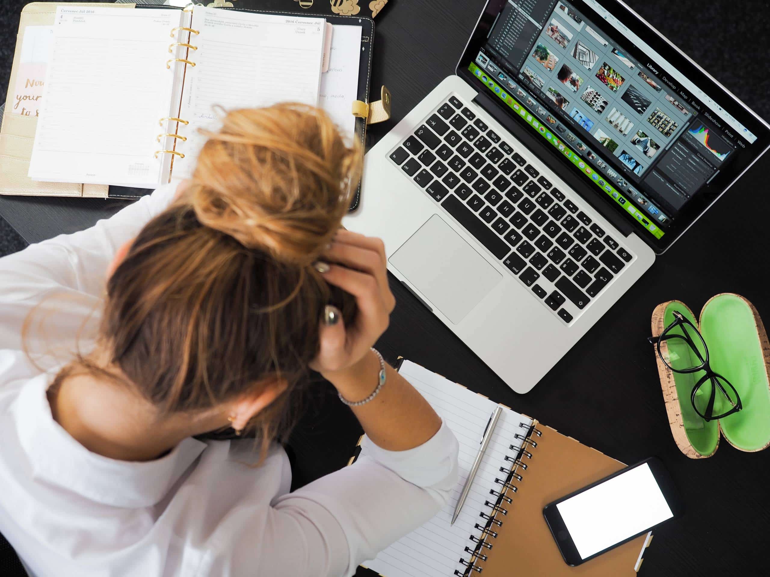 frustrated woman sitting in front of laptop